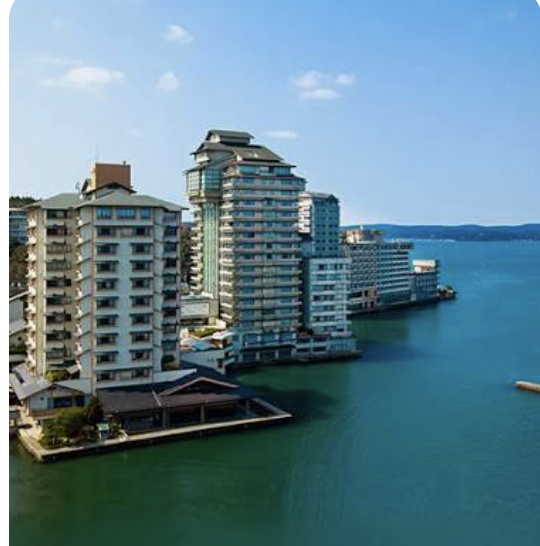 Waterfront hotel buildings on the bay at Wakura Onsen